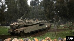 Israeli soldiers take part in a military training in the Israeli-annexed Golan Heights, near the Israel-Syria border, March 20, 2017