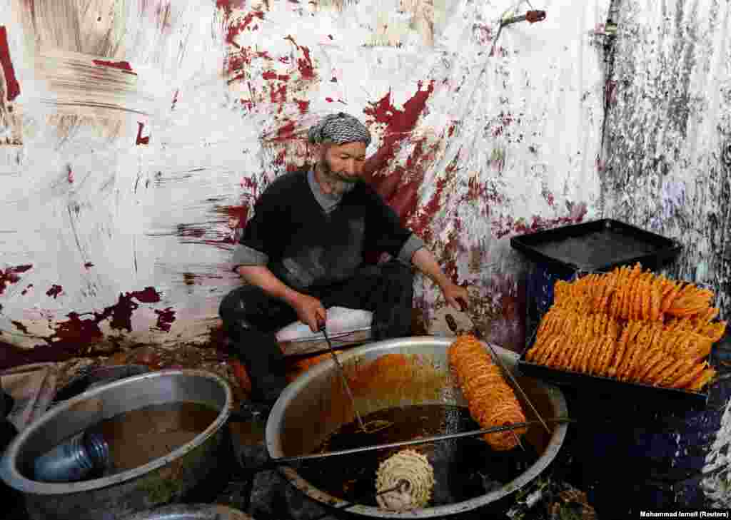 A man makes traditional jelabi sweets at a small factory ahead of the Eid al-Adha holiday in Kabul. (Reuters/Mohammad Ismail)