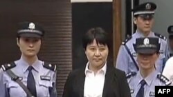 Гу Кайлай, жена свергнутого китайского политика Бо Силая. Китай, 9 августа 2012 года.

