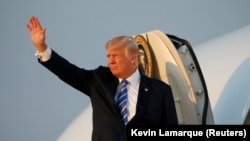 U.S. President Donald Trump boards Air Force One in Morristown, New Jersey on his way back to Washington on August 20.