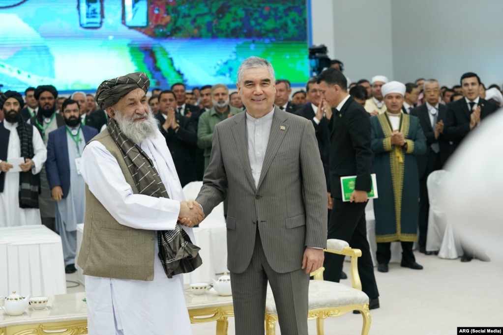 The Taliban's prime minister, Mullah Mohammad Hassan Akhund (left), and the head of the People's Council of Turkmenistan, Gurbanguly Berdymukhammedov, attend a ceremony to resume the construction of a major gas pipeline.