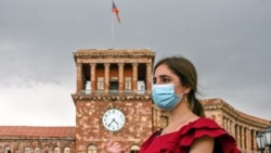 ARMENIA -- A woman wearing a protective facemask walks in central Yerevan, June 2, 2020