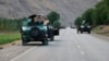 Afghan soldiers pause on a road at the front line of fighting between Taliban militants and Afghan security forces in the province of Badakhshan in northern Afghanistan on July 4.