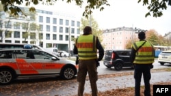 German policemen stand guard near Munich's Rosenheimer Platz after a man attacked passersby with a knife on October 21.