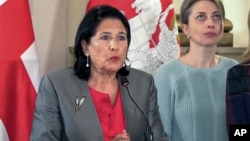 Georgian President Salome Zurabishvili speaks to the media in Tbilisi on October 27. She called for street protests after a parliamentary vote that she claims was marred by a "Russian special operation."