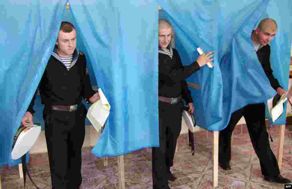 Navy sailors leave the voting booth in Sevastopol.