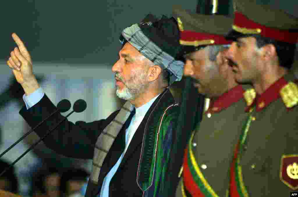 Karzai speaks&nbsp;during an emergency&nbsp;Loya Jirga, or&nbsp;grand&nbsp;assembly, in Kabul on June 19, 2002, during which he was&nbsp;chosen for a two-year term as interim president of the Afghan transitional government. 