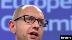 Ukrainian Prime Minister Arseniy Yatsenyuk said he would not negotiate with "terrorists" unless they laid down their arms.