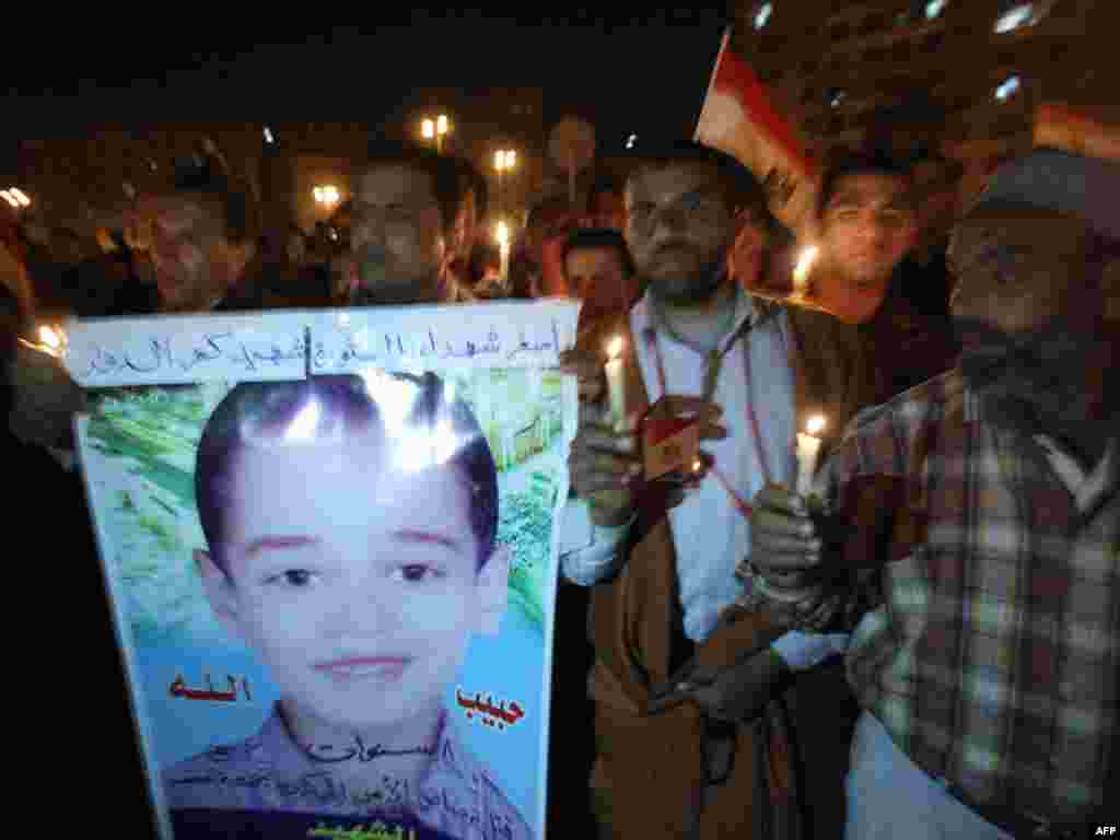 Demonstrators hold a symbolic funeral for 8-year-old Habibullah, killed in clashes with Mubarak supporters.