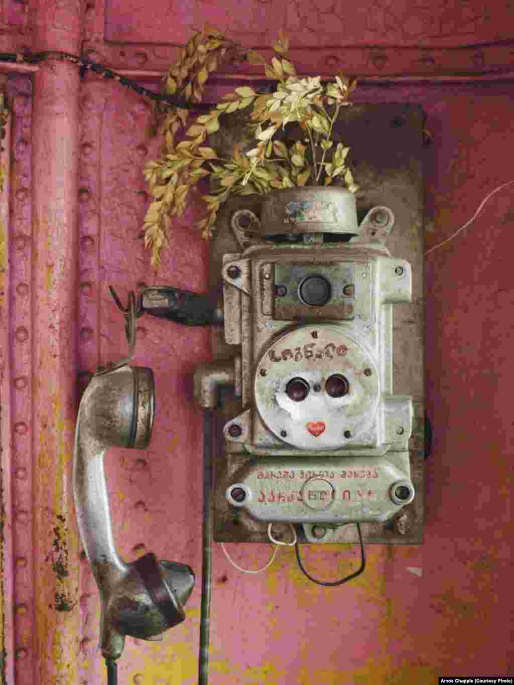 A telephone inside a cabin of Tramway 25
