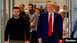 Republican presidential nominee and former U.S. President Donald Trump (right) and Ukrainian President Volodymyr Zelenskiy meet for talks at Trump Tower in New York on September 27.