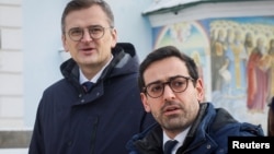 Ukrainian Foreign Minister Dmytro Kuleba (left) speaks with French Foreign Minister Stephane Sejourne in Kyiv on January 13.