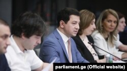 The speaker of the Georgian parliament, Archil Talakvadze (center), presents amendments to the constitution and the Electoral Code in Tbilisi on August 5.