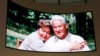 Visitors are greeted by Russian President Boris Yeltsin and his wife, Naina, on a big screen.