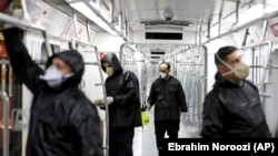 Iran -- Workers disinfect subway trains against coronavirus in Tehran, February 26, 2020.