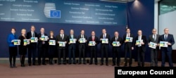 EU foreign ministers gathered for a group photo in Brussels to call on Russian authorities to release Ukrainian pilot Nadia Savchenko.