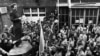 Lech Walesa (left), an electrician and underground union activist, addressing striking workers at the Lenin Shipyard in Gdansk, Poland on August 8, 1980. 