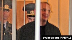 Activist Mikhas Bashura appears in court.