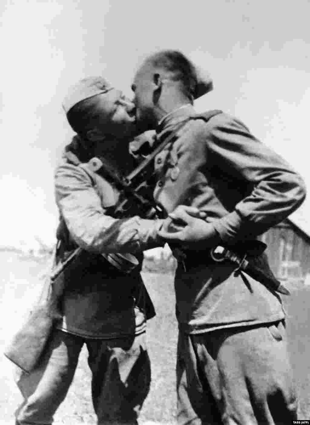 Red Army soldiers kiss after victory was declared over Nazi Germany. The &quot;socialist fraternal kiss&quot; was&nbsp;reportedly&nbsp;an expression of equality -- upturning the ancien regime&#39;s custom of lowly subjects kissing noble hands (or feet, in ancient Rome and Persia). &nbsp;