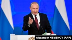 Russian President Vladimir Putin delivers a state-of-the-nation address in Moscow on February 20.
