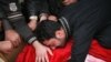 An Iraqi man weeps over the body of a relative killed in a bomb attack in Ramadi on December 30.