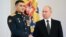 Russian President Vladimir Putin shakes hands with Lieutenant Colonel Sultan Khashegulkov during a ceremony to present Gold Star medals to service members in Moscow on December 8.