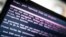 A laptop screen displays a message after it was infected with ransomware during the worldwide cyberattack on June 27.
