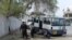 Afghan policemen inspect the scene after a deadly blast in Jalalabad on March 19. 
