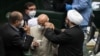 Members of the new Iranian parliament wearing masks. Undated