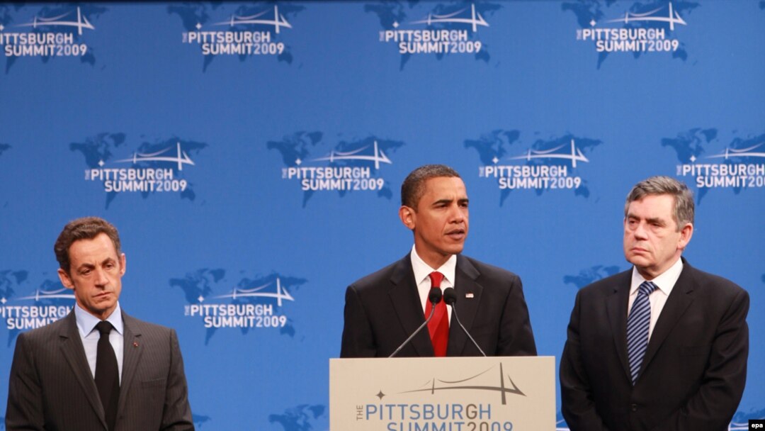 U.S. President Barack Obama is flanked by French President Nicolas Sarkozy (left) and British Prime Minister Gordon Brown on the second day of the G-20 summit in Pittsburgh.