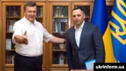 Ousted Ukrainian President Viktor Yanukovych (left) and his former deputy chief of staff, Andriy Portnov, in 2010