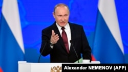 Russian President Vladimir Putin delivers a state-of-the-nation address in Moscow on February 20.