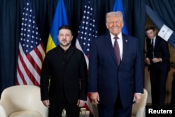 Президенти України і США після годинної розмови на полях 56-го засідання Світового економічного форуму в Давосі. Швейцарія, 22 січня 2026 року