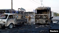 На цьому фото – наслідки іншого вибуху, здійсненого в Багдаді 13 жовтня 2014 року