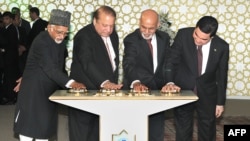 Indian Vice President, Hamid Ansari (L), along with Turkmen President Gurbanguly Berdymukhamedov (R), Afghan President Ashraf Ghani (2R) and Pakistani Prime Minister Nawaz Sharif press the button to begin the welding process of the TAPI Gas Pipeline in Mary, capital of south eastern Mary province.