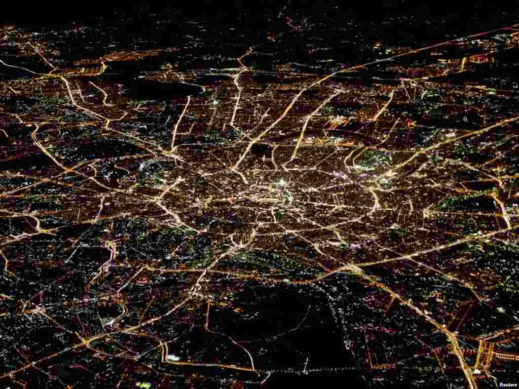 A general view of Moscow at night is seen from the window of a passenger jet on October 8. Photo by Aleksandr Demianchuk for Reuters