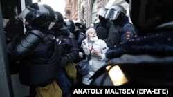 Russian police officers detain protesters during a demonstration in support of opposition leader Aleksei Navalny in St. Petersburg in January.