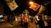 MONTENEGRO -- A man carries a cross during a church-led rally ahead of general election, in Podgorica, Montenegro, August 27, 2020. 