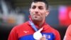 Saeid Mollaei celebrates during the medal ceremony during the Tokyo 2020 Olympic Games on July 27.