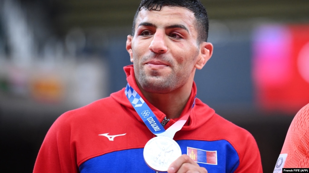 Saeid Mollaei celebrates during the medal ceremony during the Tokyo 2020 Olympic Games on July 27.