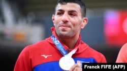 Saeid Mollaei celebrates during the medal ceremony during the Tokyo 2020 Olympic Games on July 27.