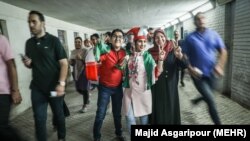 Iranian football fans in Iran watching Iran Spain game via screen