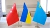 UKRAINE – Turkish, Ukrainian and Crimean tartar flags set on a table