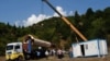 The minaret from a mosque in Chela, Georgia, being unloaded following a customs inspection in Tbilisi. 