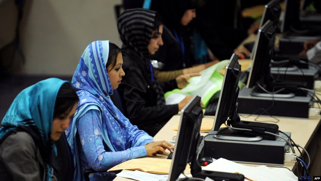 Election workers count votes at the Independent Election Commission headquarters in Kabul.