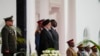 Iranian President Ebrahim Raisi (center-left) and Kenyan President William Ruto (center-right) stand for national anthems before meeting at the State House in Nairobi on July 12.