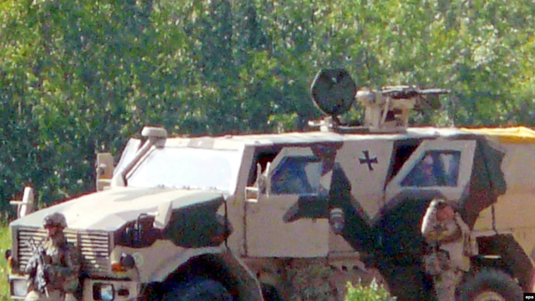German soldiers inspect the site of a suicide bombing in Kunduz Province.