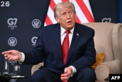 US President Donald Trump speaks on the sidelines of the G7 summit on June 17.