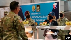  Jill Biden serves meals to U.S. troops during a visit to the Mihail Kogalniceanu Air Base in Romania on May 6