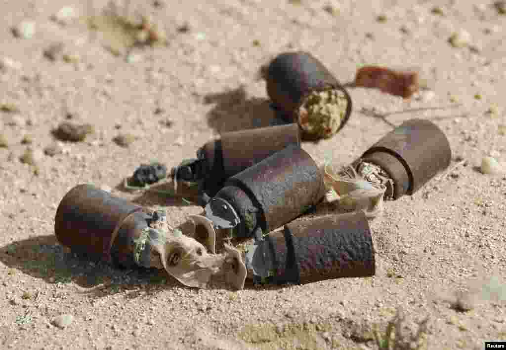 Local residents say these are unexploded U.S. bombs left over from the 2003 Iraq War in the desert south of Samawa. Iraq marked the 10th anniversary of the U.S.-led invasion that ousted Saddam Hussein on March 19. (Reuters/Mohammed Ameen)